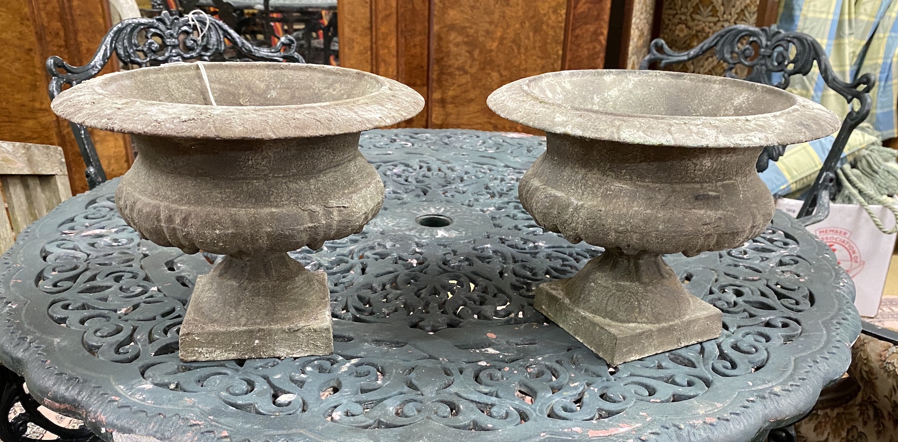 A pair of small Victorian style cast metal campana urns, diameter 27cm, height 20cm